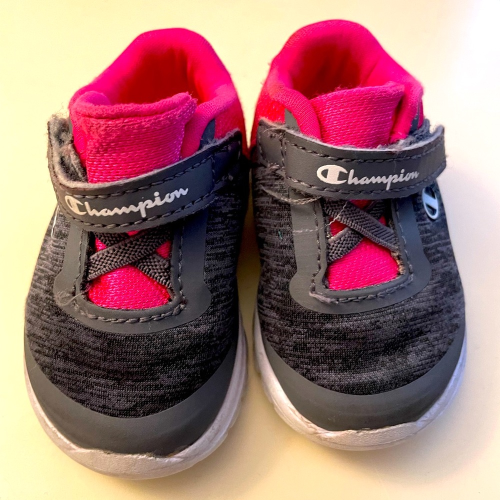 Champion. Size: 2w baby shoe. Pink and dark gray